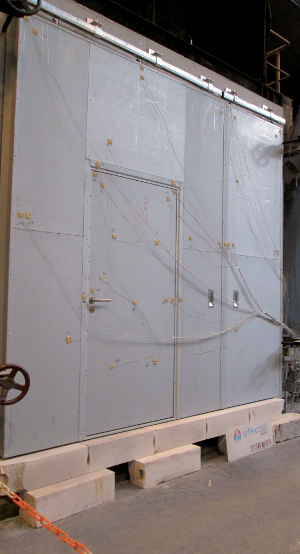 Essai EI porte coulissante avec portillon intégré. ©Portafeu